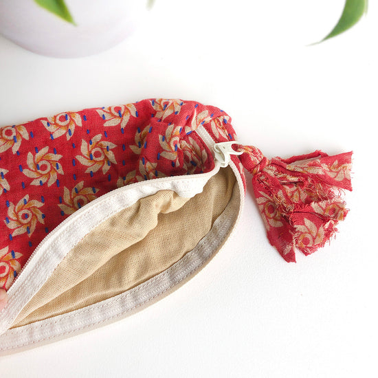 The inside of a red Kantha Brush Bag.