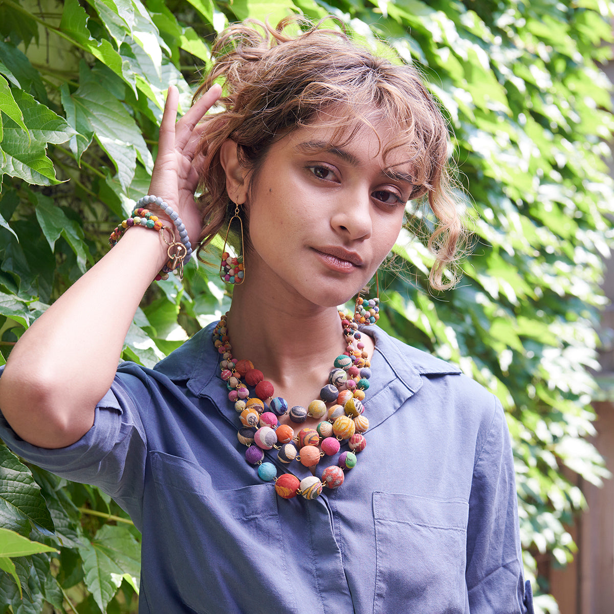A model wears the Cascading Kantha Necklace.