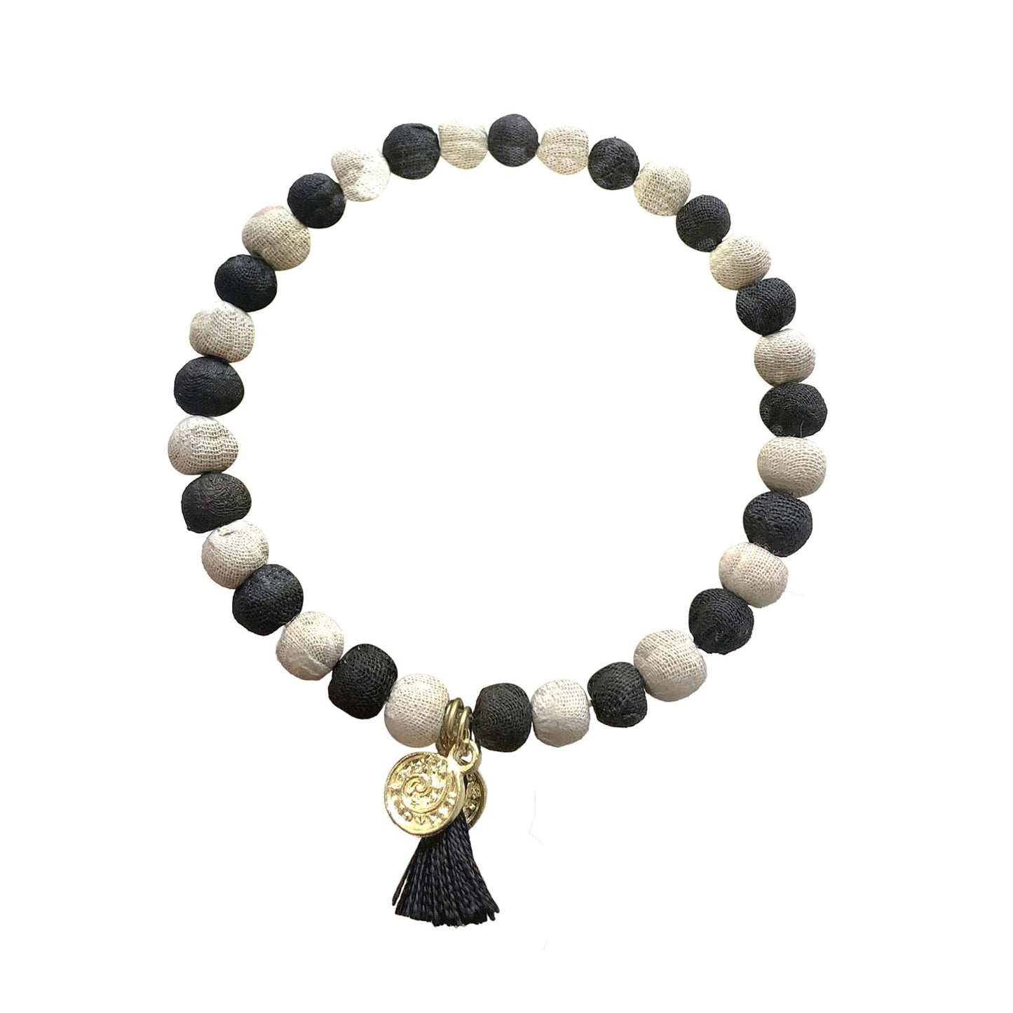 Load image into Gallery viewer, A black and white beaded bracelet with a black tassel and gold charm.
